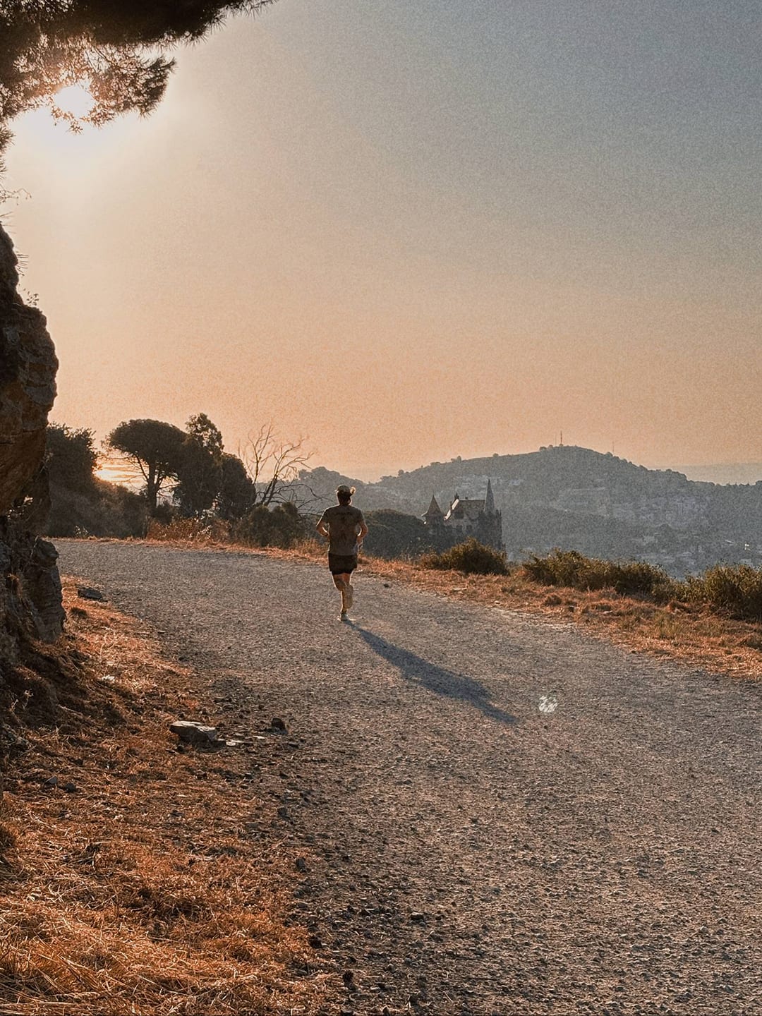 Runner on a city street at dusk — 3CNL Urban Trail series